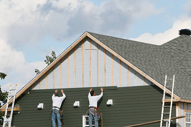 Professional Siding Installation technician working in Groveland, MA